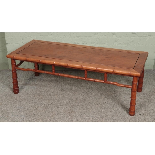 551 - A carved Chinese hardwood bamboo effect coffee table 

Hx41cm
Wx122cm
Dx51cm