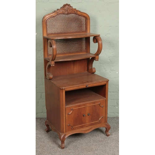 567 - A French oak cabinet with bergere back and shelving over to cupboard doors.

Hx134cm
Wx54cm
Dx41cm