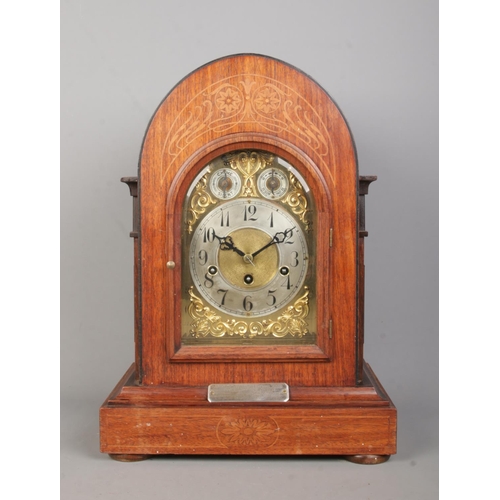 141 - A Junghans inlaid mahogany bracket clock. Having brass dial and subsidiary dials for speed and chime... 