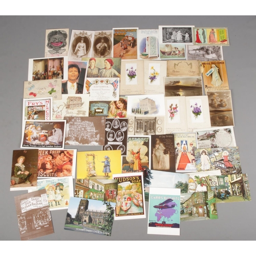 122 - A collection of vintage postcards and Christmas cards. Includes advertising, commemorative, Kissogra... 
