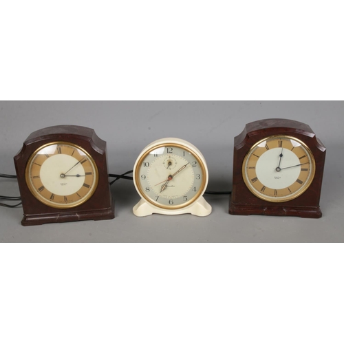 123 - Three vintage bakelite electric clocks to include Genalex and two Smith's Sectric examples.