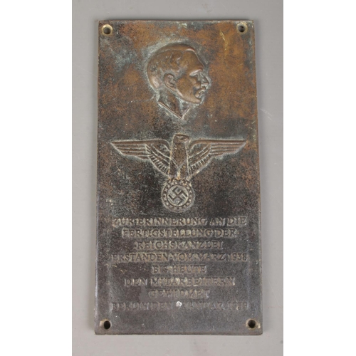 133 - A German bronze plaque commemorating the chancellery of Adolf Hitler. 29cm x 15cm.