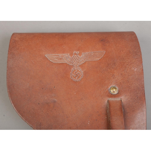 136 - A World War Two French Mab Model D leather gun holster with German capture stamps.