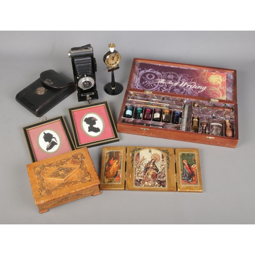 137 - A quantity of assorted collectables to include Authentic Models The Art of Writing set, Kodak Six-20... 