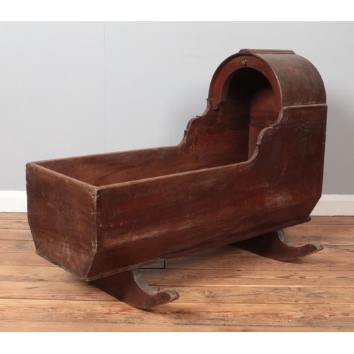 489 - A Victorian mahogany and pine rocking crib. Height 74.5cm, Length 100cm.