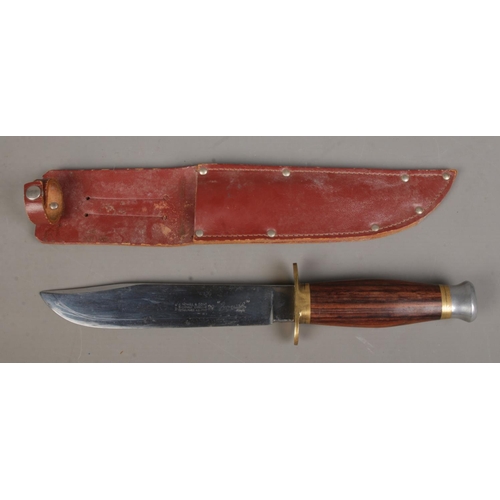106 - A J Nowill & Sons Sheffield Bowie knife in brown leather sheath. CANNOT POST OVERSEAS.