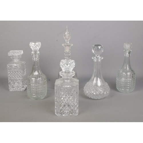 109 - Six cut and pressed glass decanters.