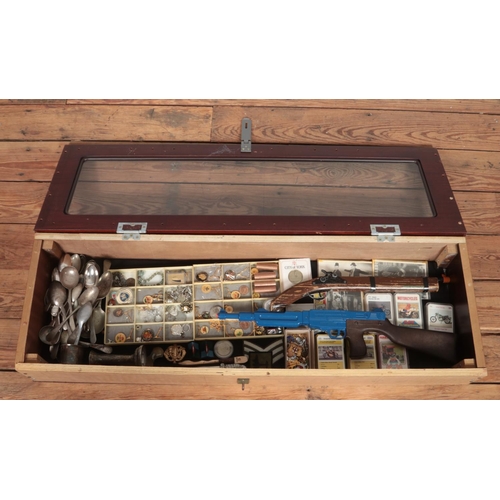 112 - A large bijouterie cabinet containing an assortment of collectables, including Top Trump cards, toy ... 