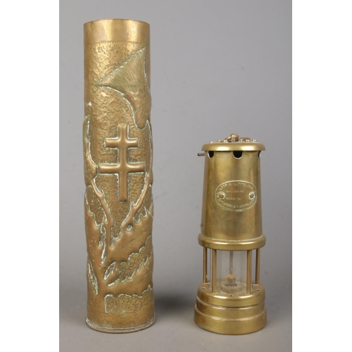 119 - A Hockley Lamp and Limelight Company miners lamp together with a detailed trench art shell case vase... 