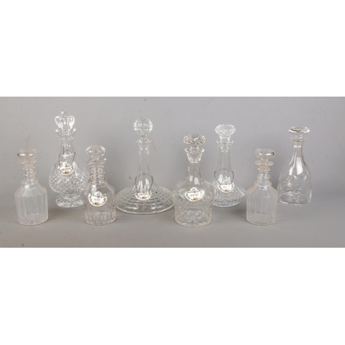 128 - Eight glass decanters, including one Waterford example, together with five ceramic Coalport decanter... 