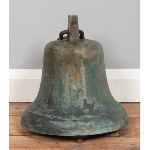 140 - A late nineteenth/early twentieth century large bronze school bell, with top mount and cast iron cla... 