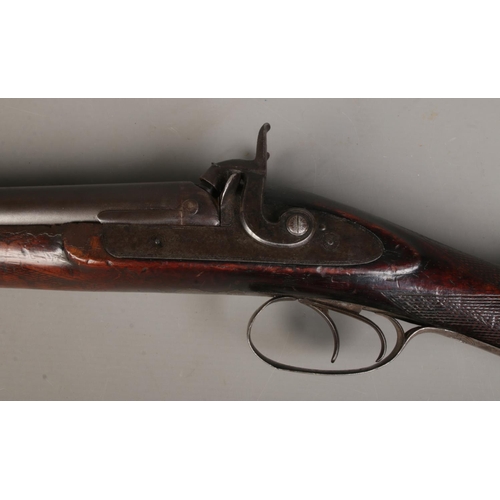158 - A Charles Pryse & Co double barrelled cape/combination rifle. With damascus barrels and walnut stock... 