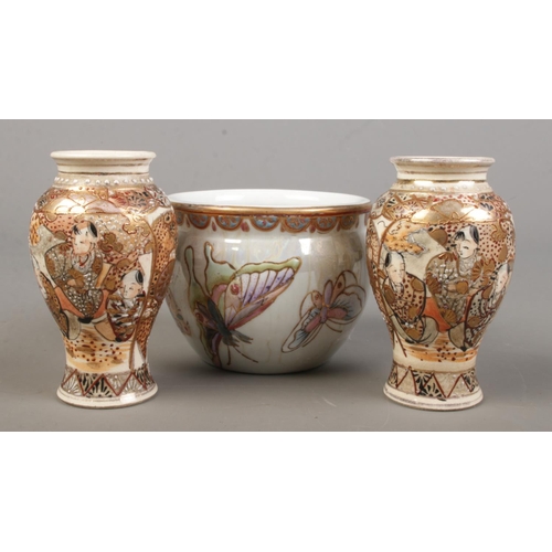 165 - A pair of small Japanese Satsuma baluster vases along with a similar bowl decorated with butterflies... 