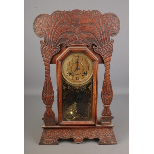 22 - Late 19th century American gingerbread mantle clock, the dial marked ' made in the New Haven Clock C... 