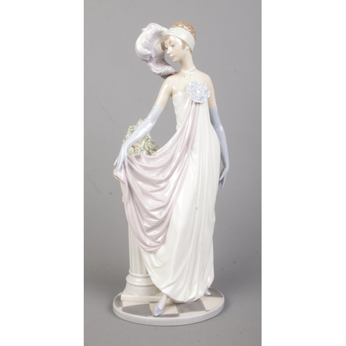 26 - A Lladro ceramic figure; Socialite of the 20's, 5283. 34cm tall.