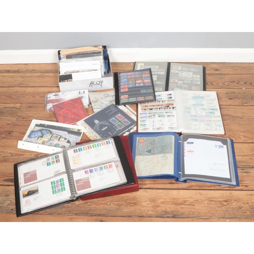 169 - A box of assorted stamps and first day covers of mainly unfranked Queen Elizabeth II examples from a... 