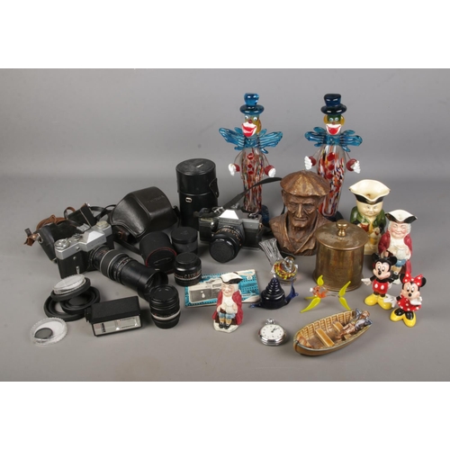 171 - A box of assorted cameras and collectables to include Workshops Ordnance trench art, Wade Man in a B... 