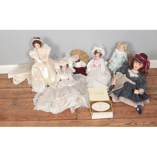 173 - A box of assorted porcelain collectors dolls to include The Doll House Company Ascot Belle and boxed... 