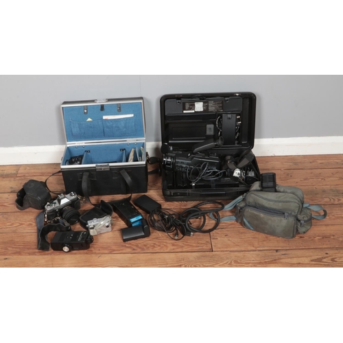 186 - A collection of assorted cameras and accessories to include Panasonic MC30, Yashica ElectroAX, Vangu... 