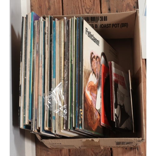 197 - A box of assorted vinyl records and single of mainly pop and rock to include Black Sabbath, Phil Col... 