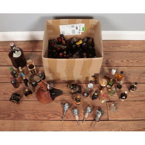 229 - A box of alcohol and alcohol miniatures, to include Malibu, Dorvell wine, Courvoisier and novelty wi... 