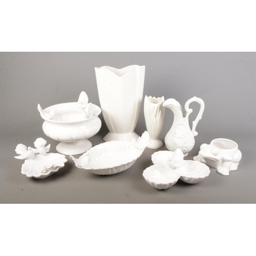 232 - A collection of white ceramics including several white bird decorated dishes and bowls.