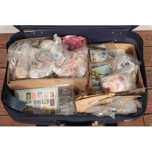 235 - A suitcase containing a large collection of used stamps, covers and postcards, including Great Briti... 