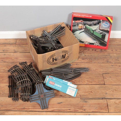 257 - A large box full of 00 gauge track including a Hornby operating turntable set, includes some 0 gauge... 