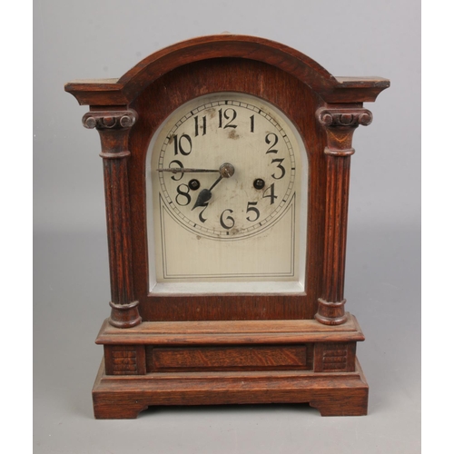 41 - Wooden cased Victorian mantel clock and key with movement marked CB of Badische Uhrenfabrik