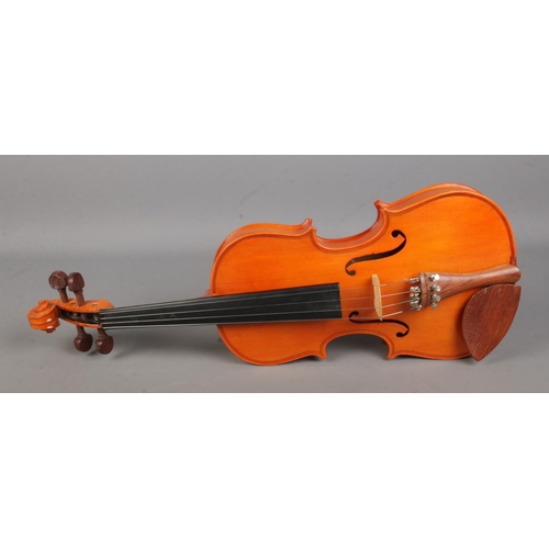 261 - A cased Stentor Student violin with bow.