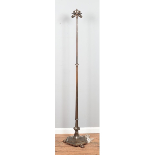 272 - A bronze 'Rise and Fall' standard lamp, on hexagonal base, raised on three ball feet. Maximum height... 