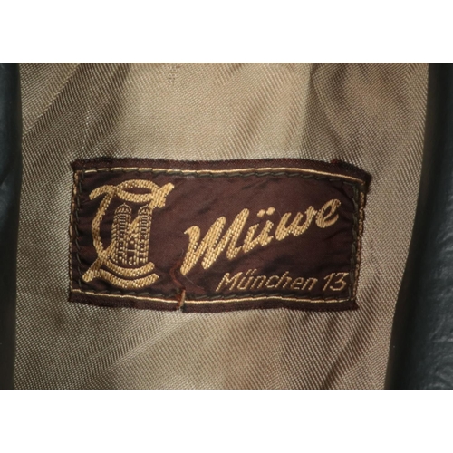 317 - A full length black leather jacket. Label for Muwe, Munchen. Size 48.