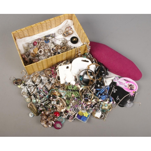 69 - A box of modern costume jewellery. Includes shell necklace, pendants, brooches, rings etc.