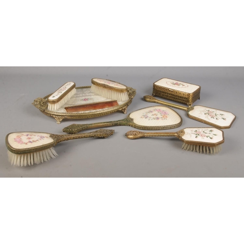 71 - A collection of dressing table sets, to include hand brushes and mirrors, comb and stand. Features R... 