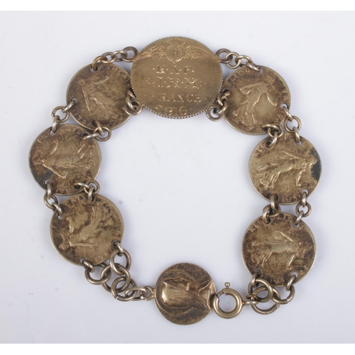 393 - A Royal Flying Corps sweetheart coin bracelet, composed of 1914-17 50 Cenitmes coins and central coi... 