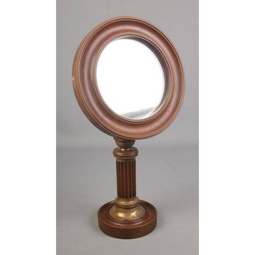 83 - An early 20th century mahogany shaving mirror with brass fluted pedestal base.