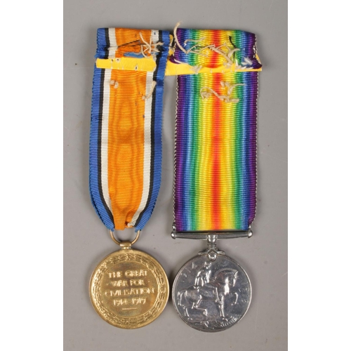 437 - A pair of World War One medals presented to Private F Crossley, Army Ordnance Corps, 020953. British... 