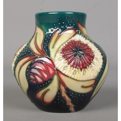 452 - A Moorcroft pottery vase of ovoid form, in the 'Albany' pattern. 8.5cm tall. Bares leaf mark to base... 