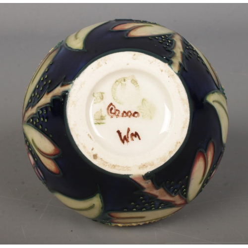 452 - A Moorcroft pottery vase of ovoid form, in the 'Albany' pattern. 8.5cm tall. Bares leaf mark to base... 