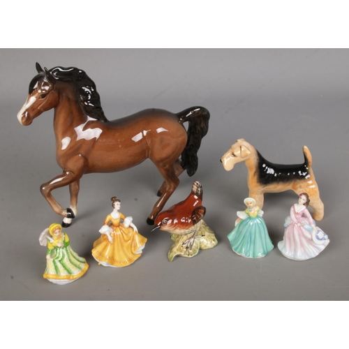 453 - A collection of ceramic figures to include Beswick prancing horse, Airedale Terrier and Wren along w... 