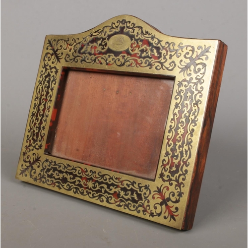 468 - A Victorian mahogany and tortoiseshell Boulle photo frame, with front motto for Gang Warily 'Go Care... 