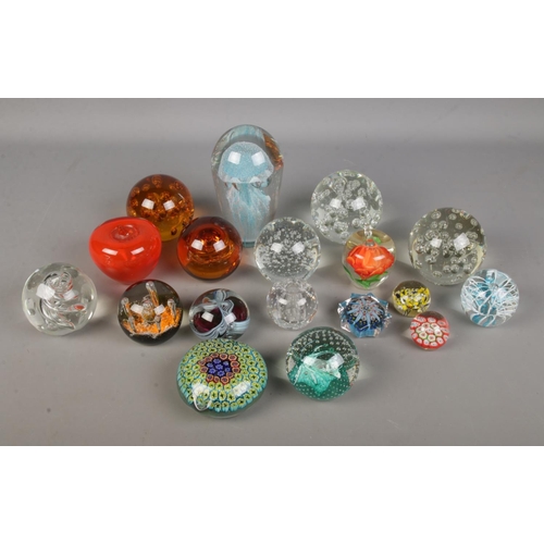 9 - A good collection of glass paperweights to include large jellyfish, floral, apple and millefiori exa... 