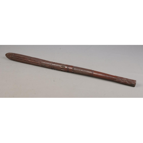 95 - A carved hardwood tribal club, possibly Aboriginal. With chequered and banded design and tapered foo... 