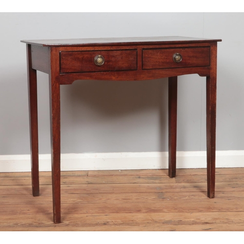 475 - A Georgian Mahogany side table having two short drawers with brass ring pull handles.

Hx75cm
Wx83cm... 