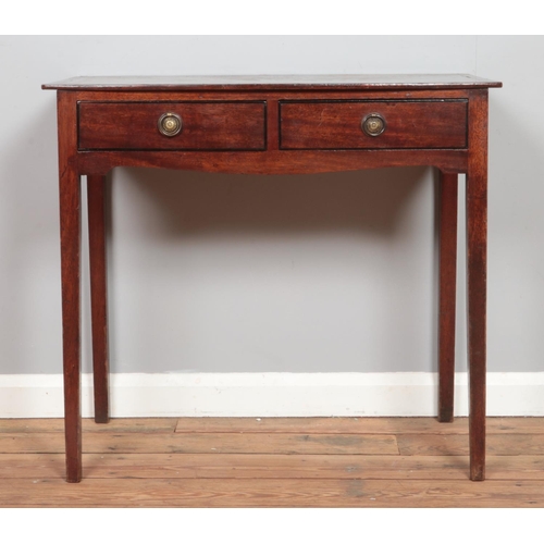 475 - A Georgian Mahogany side table having two short drawers with brass ring pull handles.

Hx75cm
Wx83cm... 