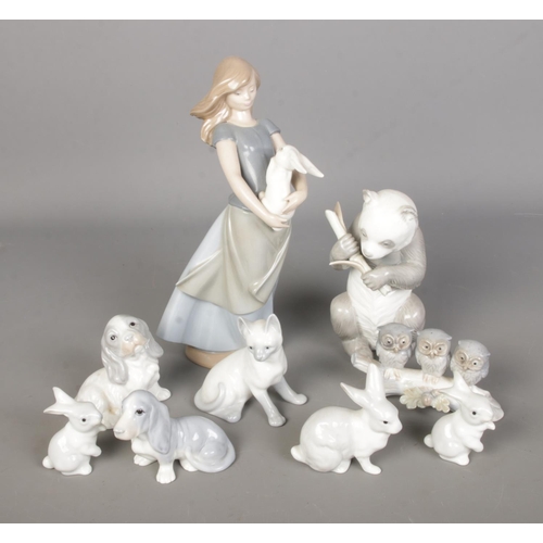 98 - A collection of Nao by Lladro and John Jenkins figures to include Giant Panda, cat, girl with rabbit... 