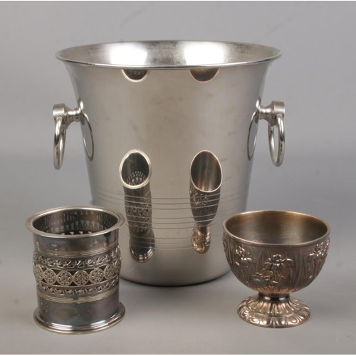 497 - A collection of silver plated items. Includes a Guy Degrenne twin handled ice/champagne bucket, a Go... 