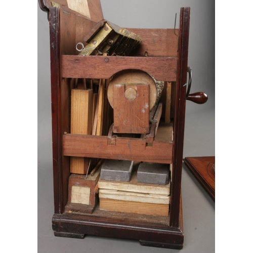 1 - A late 18th/early 19th century mahogany barrel organ. Height 30.5cm.