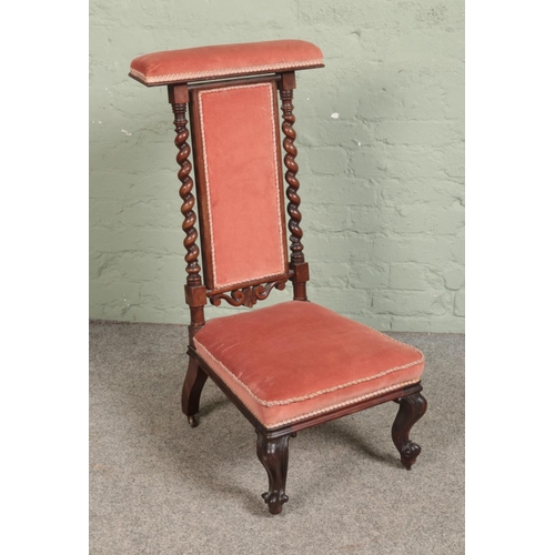 546 - A Victorian velvet upholstered prie dieu/prayer chair featuring barley twist back supports.