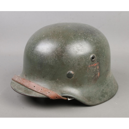 143 - A German World War Two M40 steel helmet.